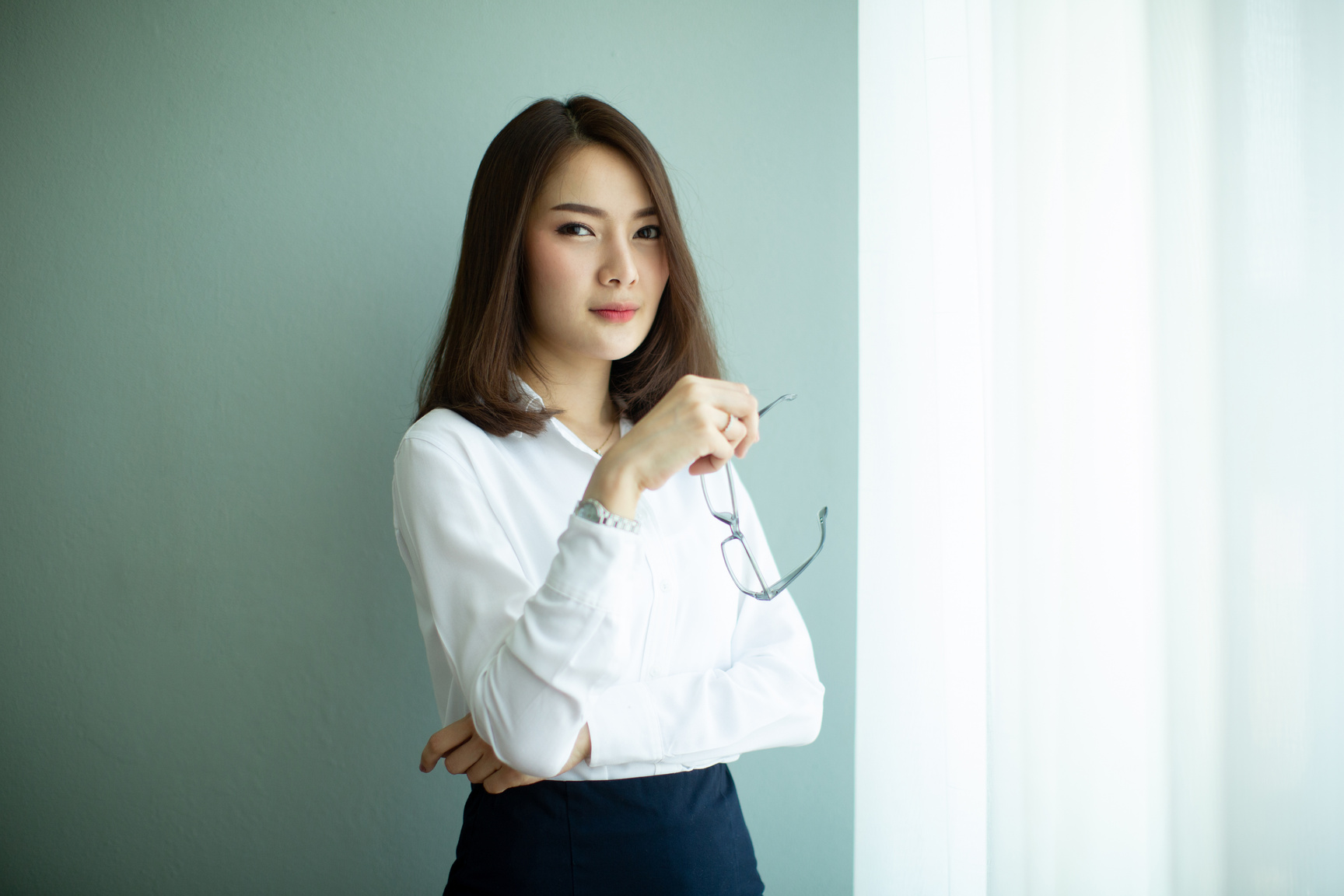 Beautiful Young Asia Woman in Office